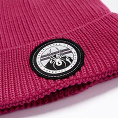 A custom Spyder logo patch adorns this simplistic polyester rolled cuff beanie which is at home on the playground or the ski mountain. Casual Outdoor Hat With Custom Logo, Cotton Beanie With Logo Patch, Pink Outdoor Beanie Cap, Winter Outdoor Beanie With Logo Patch, Winter Cotton Beanie With Logo Patch, Pink Beanie For Outdoor, Link Hat, Ski Mountain, Polyester Yarn