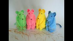 four knitted mice sitting next to each other