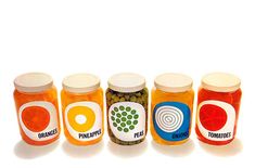 six jars filled with different types of food on top of each other and the lids are labeled oranges, pineapples, peas, pistats