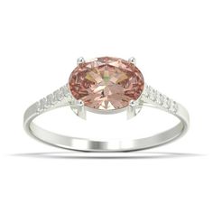 a pink diamond ring with white diamonds on the band and an oval cut stone in the center