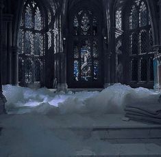 an old church with snow piled on the floor and stained glass windows in the background