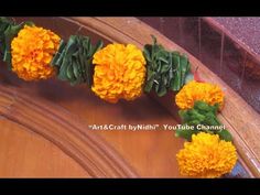 yellow flowers are arranged on the side of a wooden door