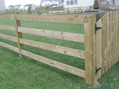 a wooden fence with wire around it