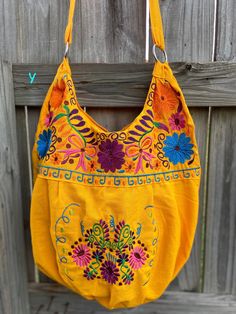 "Super Cute Floral Embroidered Bag from Puebla, Mexico Overview *Thread material * Cotton Fabric *approximate measurements: 13\" from bottom to zipper area & 15-16 with if expanded *handmade *Design colors may vary per purse as all are embroidered with unique colors * Closure is zipper or magnetic button - you can specify in notes section @ checkout which one you prefer * One pocket inside Care *hand wash only *delicate care *hang dry Please email me your questions before buying. All of my i Floral Embroidered Hobo Shoulder Bag, Embroidered Satchel Hobo Bag For Daily Use, Everyday Embroidered Hobo Shoulder Bag, Embroidered Hobo Tote Bag For Travel, Embroidered Hobo Bag Tote For Travel, Embroidered Tote Hobo Bag For Travel, Embroidered Hobo Shoulder Bag For Everyday Use, Embroidered Orange Bags For Daily Use, Daily Use Orange Embroidered Bag