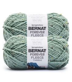 two skeins of yarn in light green