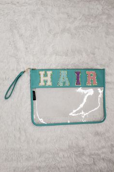 a clear purse with the word hair on it