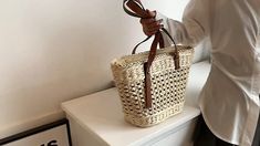 Trendy Rectangular Straw Bag For Daily Use, Elegant Woven Straw Tote Bag, Straw Beach Bag For Shopping, Trendy Open Weave Straw Bag For Daily Use, Elegant Natural Straw Bag For Shopping, Elegant Natural Straw Shopping Bag, Trendy Handwoven Beige Bucket Bag, Casual Large Capacity Crochet Basket Bag, Casual Jute Bucket Bag For Spring