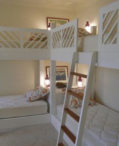 bunk beds with white mattresses in a room