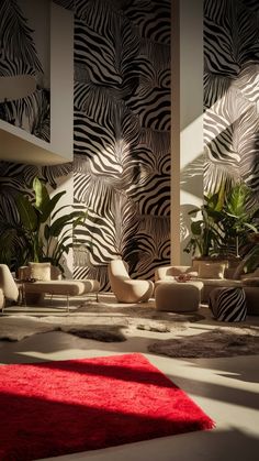 a living room with zebra print wallpaper and red rugs on the floor in front of it