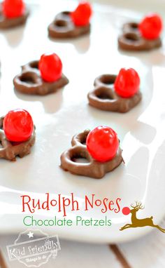 chocolate pretzels with cherries on top and rudolph's noses in the middle