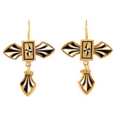 Circa 1880s, 14k, American. Visually striking, these black and white enamel earrings are far ahead of their time. Antique gold earrings always bring unique stylistic narratives to any moment of fashion. This pair is in excellent condition. Remark: "Jewelry passes from generation to generation because of its superb stylistic relevance. One-of-a-kind antique pieces like these earrings have an authentic verve that makes any look." Pictured on model with matching brooch Inv. #25060 SIZE: 1 1/4 inches long WEIGHT: 4.8 grams total STONES: Enamel HALLMARKS: None STOCK NUMBER: 24736 Jewelry acquired from this dealer must delight you. Purchases may be returned for any reason for a period of 7 days.