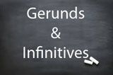 the words gerunds and infinities written on a blackboard