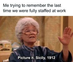 an older woman with glasses is holding her hand up in front of the camera and saying, me trying to remember the last time we were fully staff at work picture it