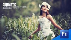 a woman in a white dress standing in a corn field