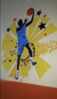 a painting of a basketball player is on the side of a wall with stars and fireworks