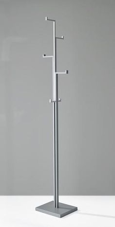 a tall metal pole with three hooks on it's sides and two poles in the middle