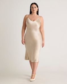 We love the midi length and bias cut of this dress. This super flattering fit is made from 100% mulberry silk, in a satin finish, and is now available in extended sizes. The kicker? Our silk is washable. Easy to style, easy to wash for low-maintenance luxe. Plus, silk fiber contains 18 kinds of amino acids that make it amazing for skin nourishment, hypo-allergenic, and naturally thermoregulating to help maintain body temperature.Also offered in sizes XS-XL. Silk Dresses Outfit, Silk Fiber, Silk Cami, Quarter Zip Sweater, Silk Slip Dress, Body Temperature, Silk Slip, Dress 100, Mulberry Silk