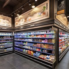 an empty grocery store filled with lots of food and drink bottles on display in front of the shelves