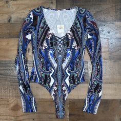 Free People New With Tags Blue Print Body Suit Size Small Has Long Sleeves And Snaps Closed At The Crotch Stretchy 95 % Cotton 5% Spandex Lying Flat Measures Roughly 15 1/4 Inches From Armpit To Armpit, From Armpit To End Of Sleeve Is A Little Over 20 Inches, From The Neck To The Bottom Is Approximately 28 Inches I Love To Bundle! Same Or Next Business Day Shipping Clean Non Smoking Home Thank You For Checking Out My Closet! Blue Long Sleeve Printed Bodysuit, Blue Stretch Printed Bodysuit, Casual Printed Blue Bodysuit, Fitted Blue Top With Paisley Print, Blue Fitted Top With Paisley Print, Blue Stretch Bodysuit With Floral Print, Blue Floral Print Stretch Bodysuit, Casual Blue Floral Print Bodysuit, Black Tank Top Bodysuit