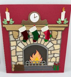 a christmas card with stockings hanging over a fire place in front of a clock and fireplace