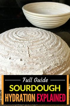 a round cake sitting on top of a pan covered in powdered sugar next to a white bowl