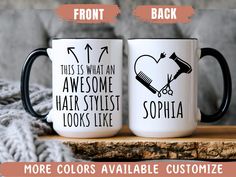 two coffee mugs sitting on top of a wooden table next to each other with the words, this is what an awesome hair stylist looks like