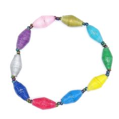 This colofrul African bead bracelet contains a random assortment of hand rolled paper beads in bright colors. The beads are handmade from recycled magazine paper that is coated in a skin-safe waterproof finish. Our fair trade bracelets are great for layering and stacking so you can wear 2, 3 or more at a time. Or share and trade them with your friends knowing you are spreading good in the world! This bracelet is also a great bracelet to wear as a matching bracelet with friends. Or you can give i Cheap Rainbow Plastic Stretch Bracelet, Magazine Paper, Recycled Magazine, African Bracelets, Bracelet Matching, Women Crafts, Rainbow Bracelet, Handcrafted Bracelets, African Beads