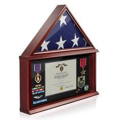 an american flag and medal display in a wooden frame with glass inserts on top