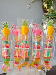 some lollipops are wrapped in plastic and have pineapples on them