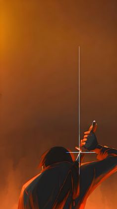 a person holding a cell phone up to their ear with an orange sky in the background