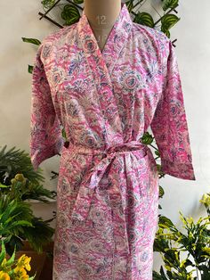 Cotton kimono robes are perfect for lounging around the home or spa. Use our floral printrobe as a cover up on the beach or after a dip in the pool. Add a luxe, boho feel to your bridal shower. Versatile, soft and luxurious, our 100% cotton kimono robes are printed with azo-free dyes. The print floral robe features 3/4th sleeves, a waist tie and two front pocket. Size - One size will fit all sizes S to XL Length - 50 inches (125Centimeter), Measurements Approx : *Length: 50" Inches *Bust Around Size: 48" Inches *Shoulder: 8" Inches *Sleeve Length: 14" Inches *Sleeve hole: 9" Inches *2 Side Pockets For best results hand wash and line dry when possible. Machine wash cold, tumble dry low and warm iron. Floral Print Kimono Sleeves Sleep Robe, Floral Print Kimono For Loungewear, Floral Print Sleepwear With Kimono Sleeves, Floral Print Long Sleeve Sleep Kimono, Summer Floral Print Robe, Pink Spring Robe For Relaxation, Wedding Robe With Kimono Sleeves For Spring, Spring Wedding Sleepwear With Kimono Sleeves, Spring Wedding Robe With Kimono Sleeves