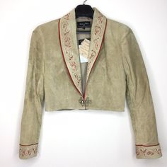 Western Hand Painted Suede Bolero Jacket by artist designer Patricia Wolf. Size: Women's Large. Color: Sand Jacket is in great condition with original tags. Pig Suede. Made in Texas, USA. Please see photos for measurements. Fitted Western Leather Jacket With Long Sleeves, Western Style Fitted Leather Jacket For Winter, Fitted Western Leather Jacket For Winter, Western Style Long Sleeve Fitted Blazer, Fitted Vintage Cropped Jacket For Fall, Western Style Fitted Blazer For Fall, Fitted Western Style Outerwear For Spring, Fitted Western Style Spring Outerwear, Fitted Western Outerwear For Spring