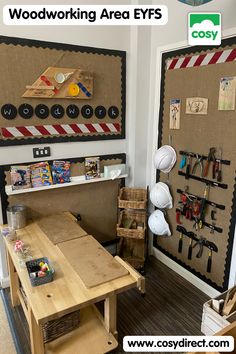 there is a work area with tools on the wall and in front of it are two bulletin boards that read woodworking area eyes