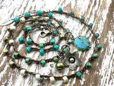 "This Bohemian style beaded necklace is crocheted with durable nylon beading cord and features an eclectic mix of Czech glass beads (teal, mint, blue, Picasso finish). It looks great worn alone or layered with other pieces of jewelry. It can be worn as a SINGLE LONG STRAND necklace OR as a 3x WRAP BRACELET (the strand can be wrapped 3 times around an average wrist). Unique, Lightweight, Boho Chic, just beautiful! The total necklace length is 21 inches (20\" crocheted with an 1\" Stainless Steel Blue Picasso, Beading Cord, Boho Hippie Chic, Chic Necklace, Metal Tags, Summer Necklace, Hand Stamped Jewelry, Mint Blue, Stamped Jewelry