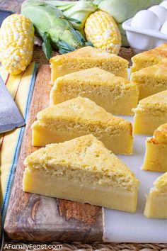 corn on the cob is cut into squares and placed on a cutting board