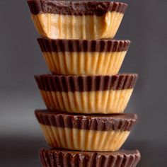 three chocolate cups stacked on top of each other with peanut butter in the middle,