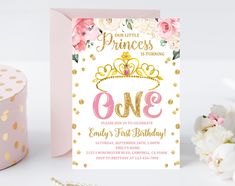 a pink and gold princess 1st birthday party with flowers on the table next to it