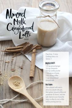 the ingredients to make an almond milk recipe are displayed on a wooden table with a spoon