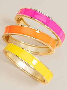 In a slew of fabulous colors, this bracelet screams stacking and stylish! -Closure: Open -Measurements: 3" wide, 8" around, 1/2" tall -Materials: base metal, enamel -Style: Bangle -Fit: Hinge open -Scale: Stacking -0.1 Lbs -Nickel and Lead Compliant (Hypoallergenic) Multicolor Enamel Bangle Bracelets, Color Me Happy, Bracelets Fashion, Arm Candy, Base Metal, Bangle Bracelet, Color Me, Slip On Sandal, New Fashion