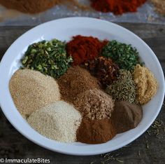 a white bowl filled with different types of spices