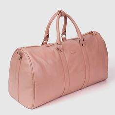 High quality Full Grain Vegan Leather Exposed contrast zippers Standard Cut away storage inner pocket Vegan leather/canvas padded shoulder straps 5 metal landing docks on the bottom Dimensions: 21” (L) x 8” (W) x 14” (H) Functional Pink Leather Bags, Pink Leather Bag With Leather Trim, Pink Duffle Bag With Zipper For Weekend Trips, Pink Duffle Bag For Weekend Trips With Zipper Closure, Pink Duffle Bag With Zipper For Overnight Trips, Pink Duffle Bag With Zipper Closure For Overnight Trips, Everyday Pink Duffle Bag With Zipper, Everyday Pink Duffle Bag With Zipper Closure, Pink Everyday Bags With Leather Lining