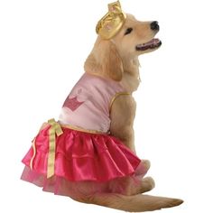 a dog wearing a pink and gold dress with a golden crown on it's head