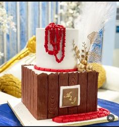 a cake made to look like a wooden structure with beads on the top and sides