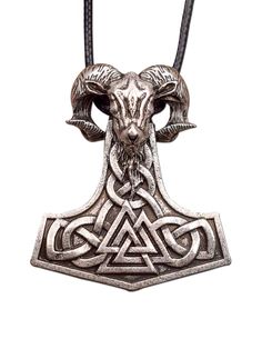 an oxen pendant with two horns on a leather cord, in the shape of a triangle