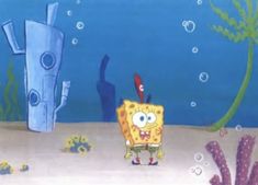 spongebob is standing in the ocean with an octopus