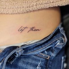 a woman's stomach with the word get them written on it, in cursive font