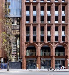 a tall brick building sitting next to a street