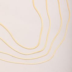 Redefine your daily accessories with our 14K REAL Gold Snake Chain Necklace--a timeless and unisex gold chain designed for everyday wear. This shiny serpentine chain offers a classic yet trendy look, making it the perfect gift for women and men or a thoughtful anniversary surprise.  Don't miss the chance to add sparkle to your style with this genuine gold chain. Make your statement--secure your layering chain necklace today. 📃 ITEM DETAILS * Material: Real solid Gold (no gold-filled or gold-plated) * Gold Karat: 14K (%58.5 gold purity) * Gold Color: Yellow * Chain Thickness: 1.50 mm, 1.80 mm, 2.00 mm, and 2.40 mm * Closure Style: Spring ring closure for 1.50 mm / Lobster clasp for 1.80 mm, 2.00 mm, and 2.40 mm 🎁 P A C K A G I N G * All of our products are sent with an elegant and stylish Fine Jewelry Snake Chain Necklace With Delicate Chain, Fine Jewelry Delicate Snake Chain Necklace, Gold Plated Curb Chain Necklace, Gold Curb Chain Necklace In Fine Jewelry Style, Fine Jewelry Curb Chain Necklace As Gift, Fine Jewelry Curb Chain Necklace Gift, Fine Jewelry Gift Curb Chain Necklace, Gold Plated Box Chain Necklace, Yellow Gold Snake Chain Necklace For Jewelry Making