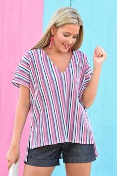 In dire need of a tropical vacation? Tell Me About It! This top deserves be somewhere on a beach! We are obsessing over this striped fabric that has a little bit of shimmer to it! We are also loving the cut of this top as the back is slightly longer than the front to keep your booty covered! Style it with a pair of white skinny jeans and bold jewelry for a fun vacay vibe! Vibrant Multicolor Beach Top, Spring Tropical Beach Cover-up Tops, Beachy Multicolor Spring Cover-up, Multicolor Printed Top For Beach Cover-up, Somewhere On A Beach, Spring Multicolor Cotton Cover-up, Mauve Dress, Bold Jewelry, Striped Fabric