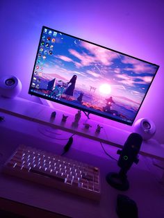 a computer monitor sitting on top of a wooden desk next to a keyboard and mouse